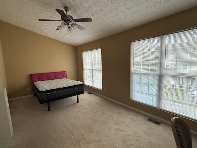 6231 Redan Overlook, Lithonia, GA 30058 - living area with a ceiling fan, light carpet, baseboards, and a textured ceiling
