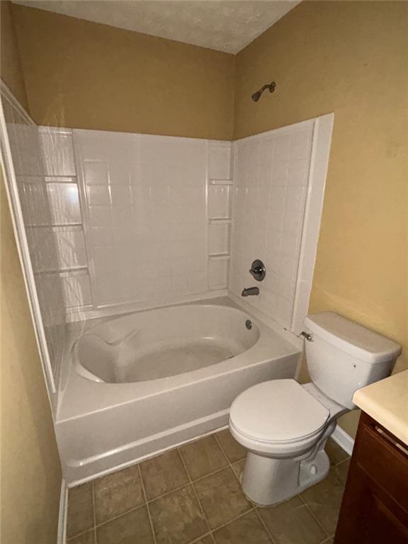 6231 Redan Overlook, Lithonia, GA 30058 - bathroom with vanity, toilet, shower / bath combination, and tile patterned flooring