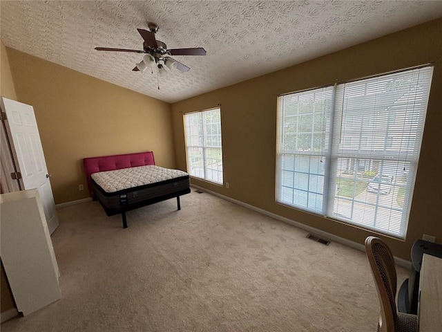 6231 Redan Overlook, Lithonia, GA 30058 - bedroom featuring light colored carpet, baseboards, ceiling fan, and a textured ceiling