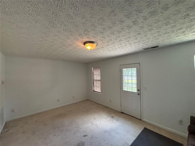 6231 Redan Overlook, Lithonia, GA 30058 - entrance foyer with baseboards, carpet flooring, and a textured ceiling