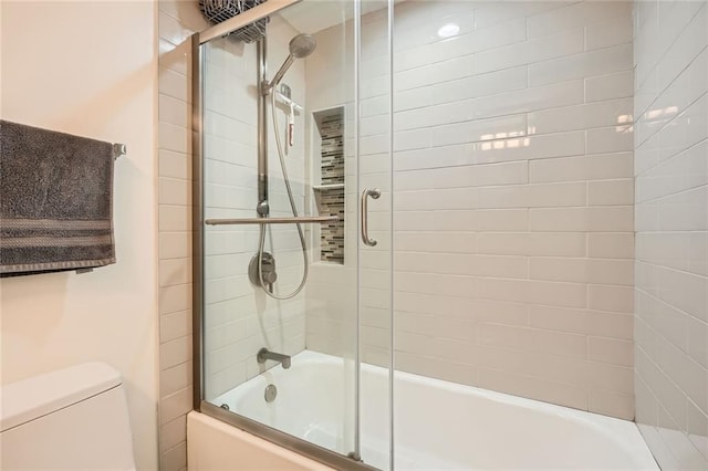 full bathroom featuring toilet and enclosed tub / shower combo