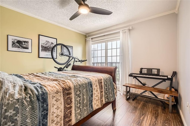 bedroom with crown molding, a textured ceiling, ceiling fan, and wood finished floors