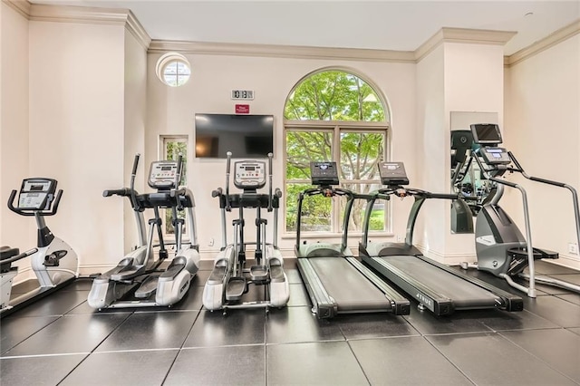 gym with a healthy amount of sunlight and ornamental molding