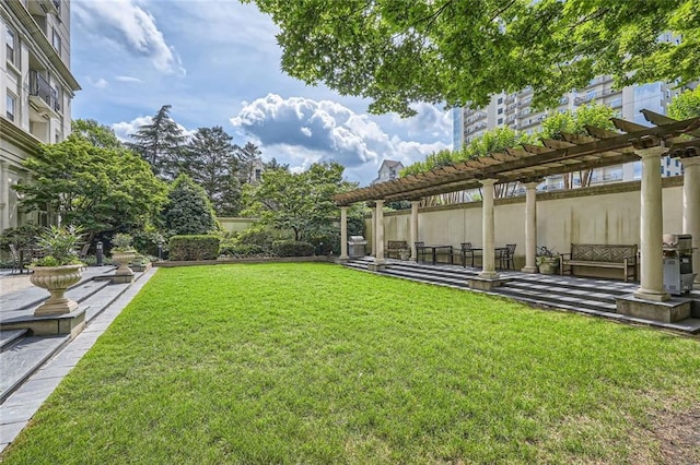 view of yard with a pergola and a patio