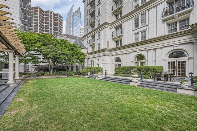 view of home's community with a lawn
