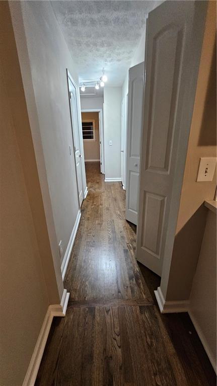 1080 Laboon Rd, Monroe, GA 30655 - corridor with wood finished floors and baseboards