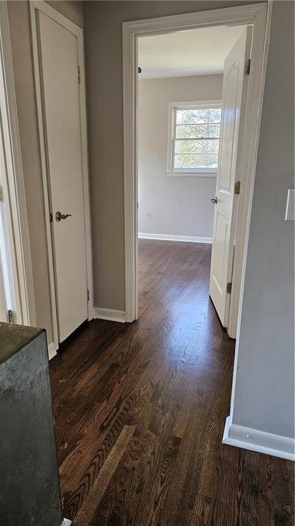 1080 Laboon Rd, Monroe, GA 30655 - corridor featuring dark wood-style floors and baseboards