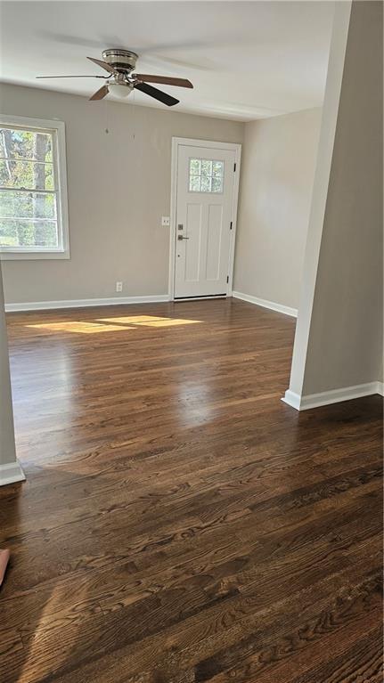 1080 Laboon Rd, Monroe, GA 30655 - foyer entrance featuring a ceiling fan, baseboards, and dark wood finished floors