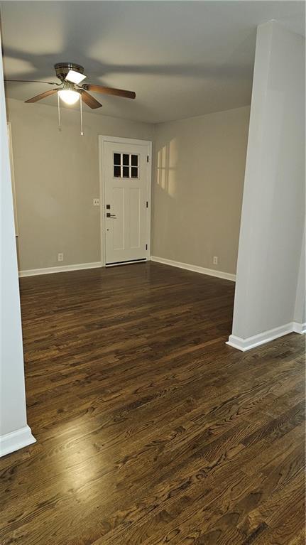 1080 Laboon Rd, Monroe, GA 30655 - foyer entrance featuring a ceiling fan, dark wood-style flooring, and baseboards