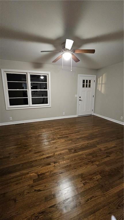 1080 Laboon Rd, Monroe, GA 30655 - empty room with ceiling fan, baseboards, and dark wood-style flooring