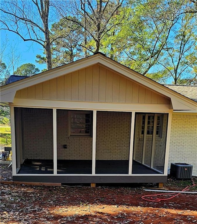 1080 Laboon Rd, Monroe, GA 30655 - view of side of property with cooling unit, brick siding, and a sunroom