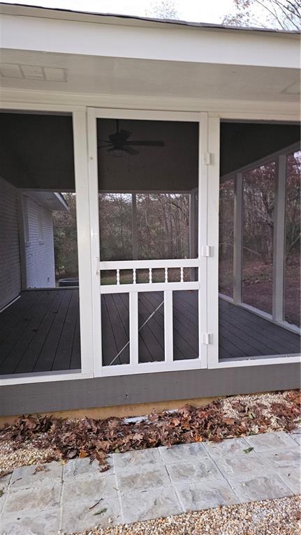 1080 Laboon Rd, Monroe, GA 30655 - view of side of home featuring a sunroom