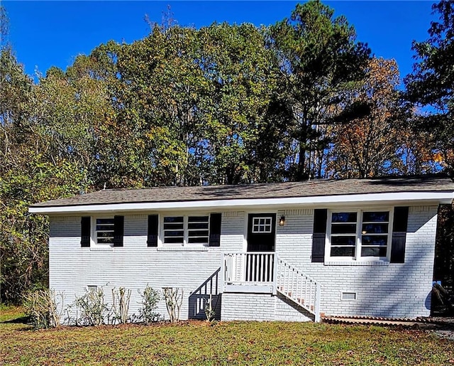 1080 Laboon Rd, Monroe, GA 30655 - view of front facade with brick siding and a front lawn