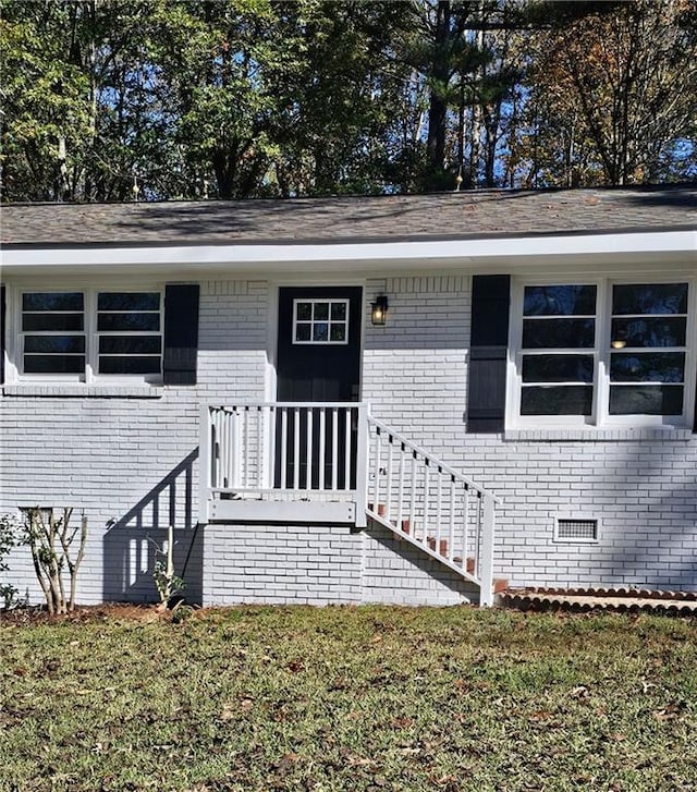1080 Laboon Rd, Monroe, GA 30655 - doorway to property featuring brick siding, a yard, and crawl space