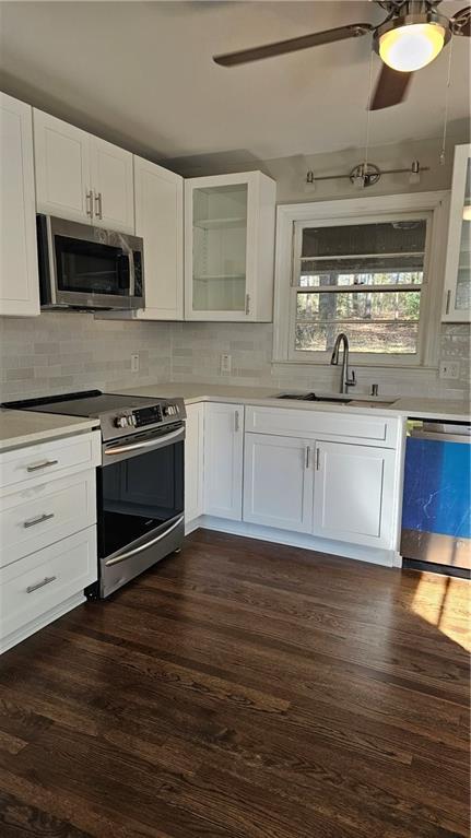 1080 Laboon Rd, Monroe, GA 30655 - kitchen with appliances with stainless steel finishes, a sink, and light countertops