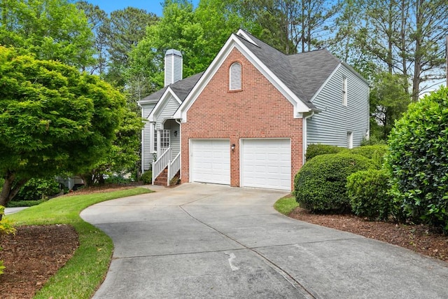 view of side of property with a garage