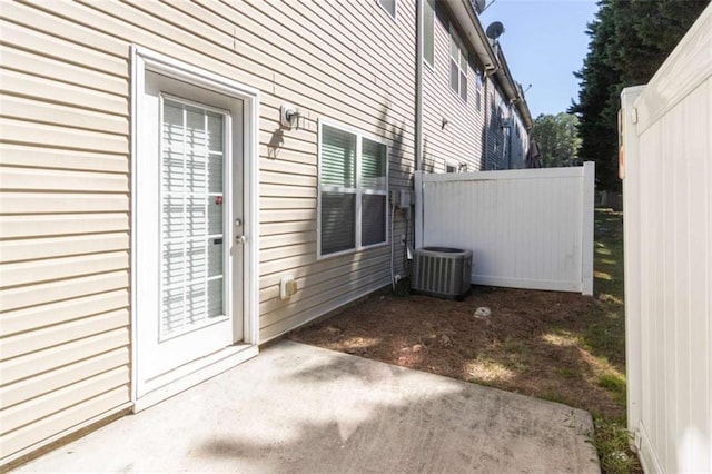 view of home's exterior featuring central air condition unit and a patio area