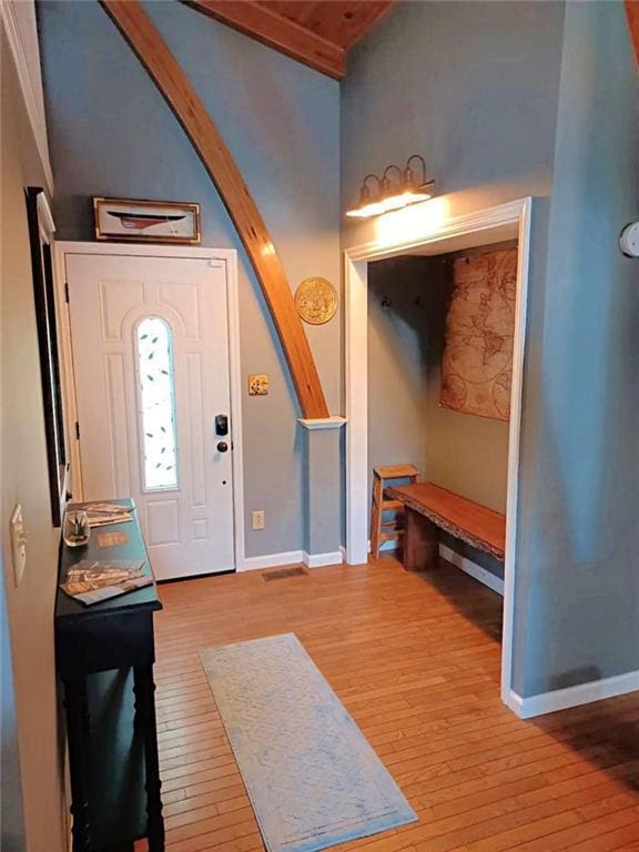 entryway with baseboards and light wood-style floors