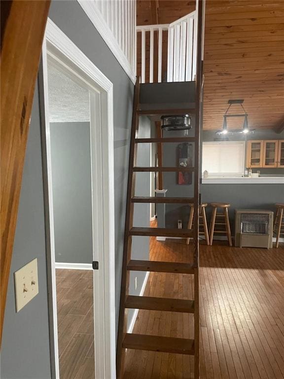 stairs with hardwood / wood-style floors