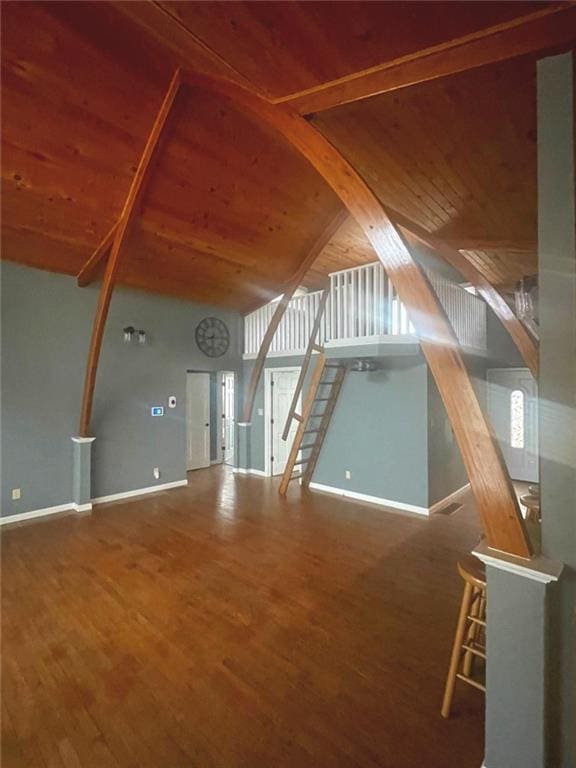 bonus room featuring wood ceiling, stairs, baseboards, and wood finished floors