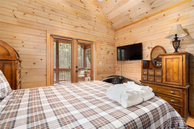 bedroom featuring lofted ceiling, access to exterior, wooden walls, and french doors