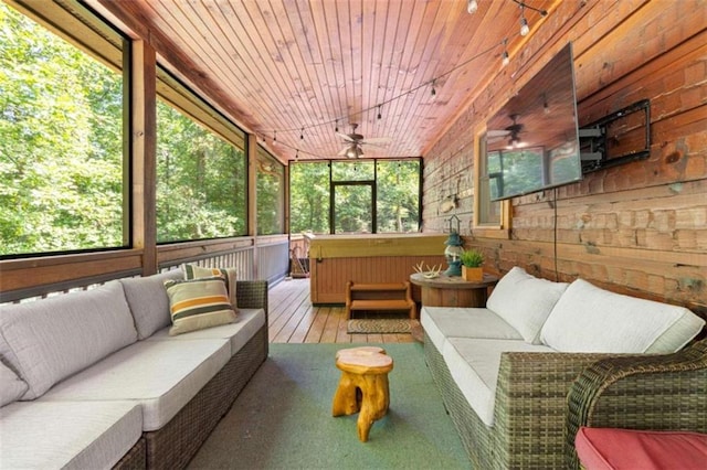 sunroom with wooden ceiling and ceiling fan