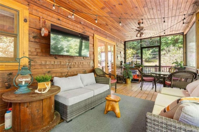 sunroom / solarium featuring wood ceiling, ceiling fan, and french doors