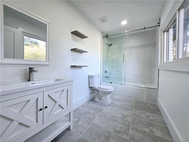 bathroom with vanity, visible vents, tile patterned flooring, toilet, and combined bath / shower with glass door