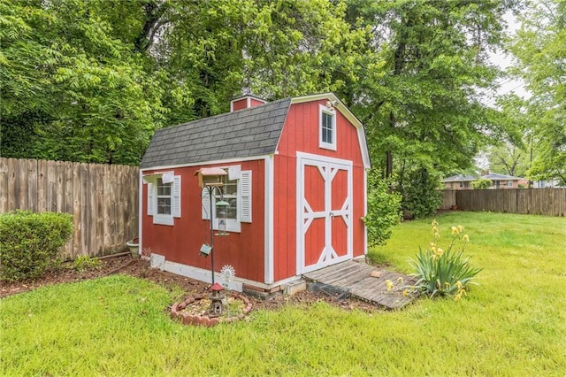 view of shed featuring a fenced backyard