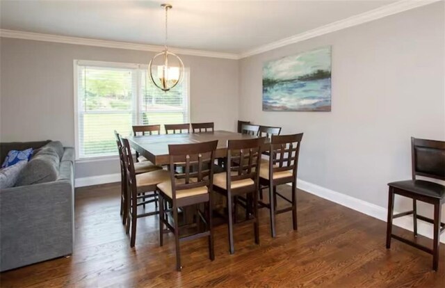 dining room with dark wood-style floors, ornamental molding, and baseboards