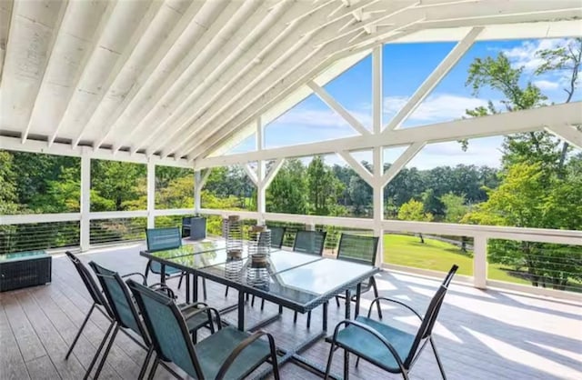 sunroom with vaulted ceiling and plenty of natural light