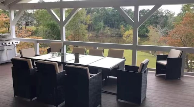 wooden deck featuring outdoor dining area and area for grilling