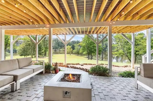 view of patio / terrace featuring an outdoor living space with a fire pit