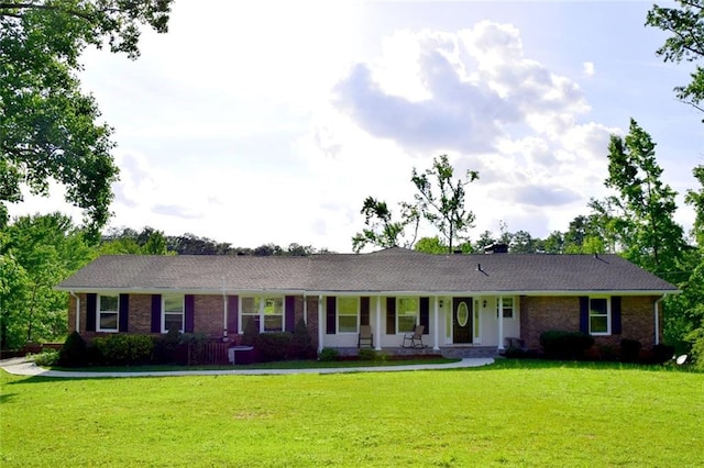 ranch-style home with a front lawn and brick siding