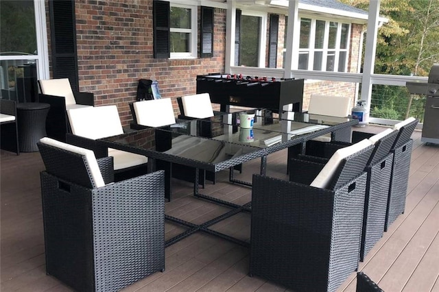 wooden terrace featuring outdoor dining area