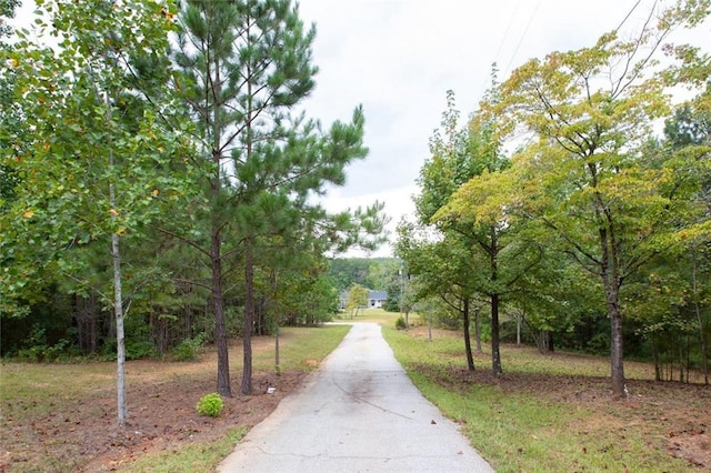 view of community with aphalt driveway