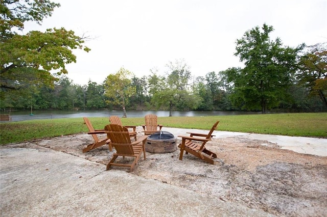 view of patio / terrace with a water view and an outdoor fire pit