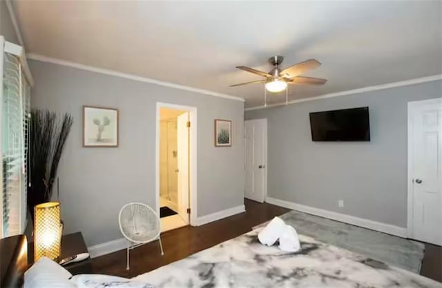 bedroom with connected bathroom, baseboards, crown molding, and wood finished floors