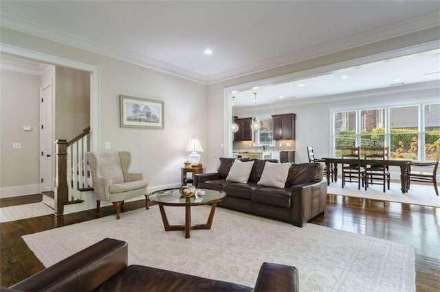 living room featuring hardwood / wood-style floors and ornamental molding