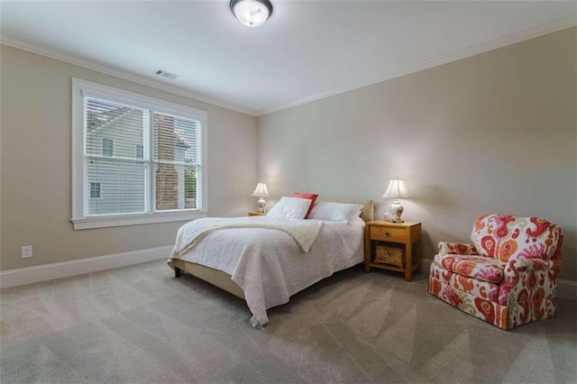 carpeted bedroom featuring ornamental molding