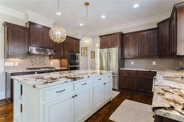 kitchen with a kitchen island, decorative light fixtures, sink, stainless steel appliances, and crown molding