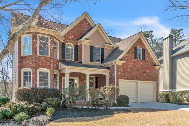 view of front of property with a garage, brick siding, driveway, and a shingled roof