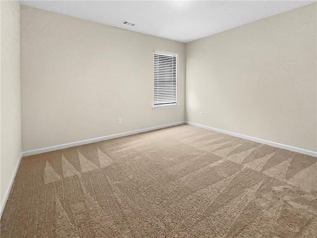 unfurnished room featuring carpet floors