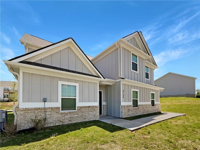 rear view of property with a yard