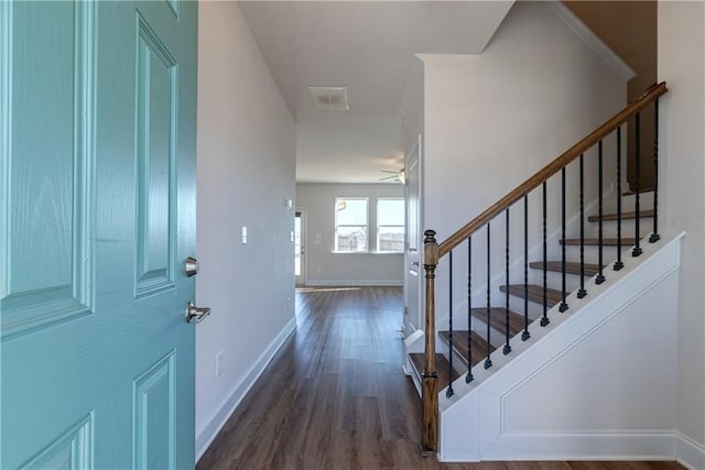 entrance foyer featuring dark wood-type flooring and ceiling fan