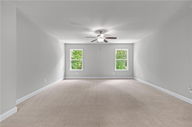 350 Paces Dr, Lithia Springs, GA 30122 - unfurnished room with ceiling fan, plenty of natural light, baseboards, and light carpet