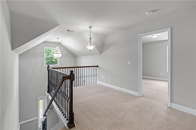 350 Paces Dr, Lithia Springs, GA 30122 - hall with carpet floors, vaulted ceiling, baseboards, and an upstairs landing