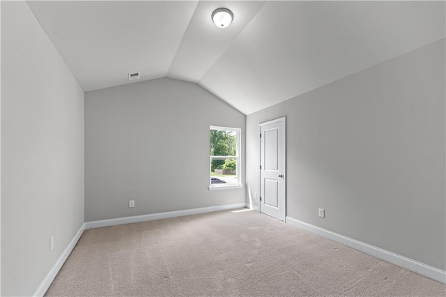 350 Paces Dr, Lithia Springs, GA 30122 - carpeted spare room with vaulted ceiling and baseboards