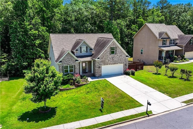 350 Paces Dr, Lithia Springs, GA 30122 - craftsman inspired home with concrete driveway, a garage, a front yard, and brick siding