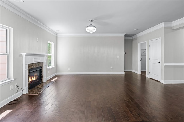 350 Paces Dr, Lithia Springs, GA 30122 - unfurnished living room featuring dark wood finished floors, a premium fireplace, ornamental molding, and baseboards